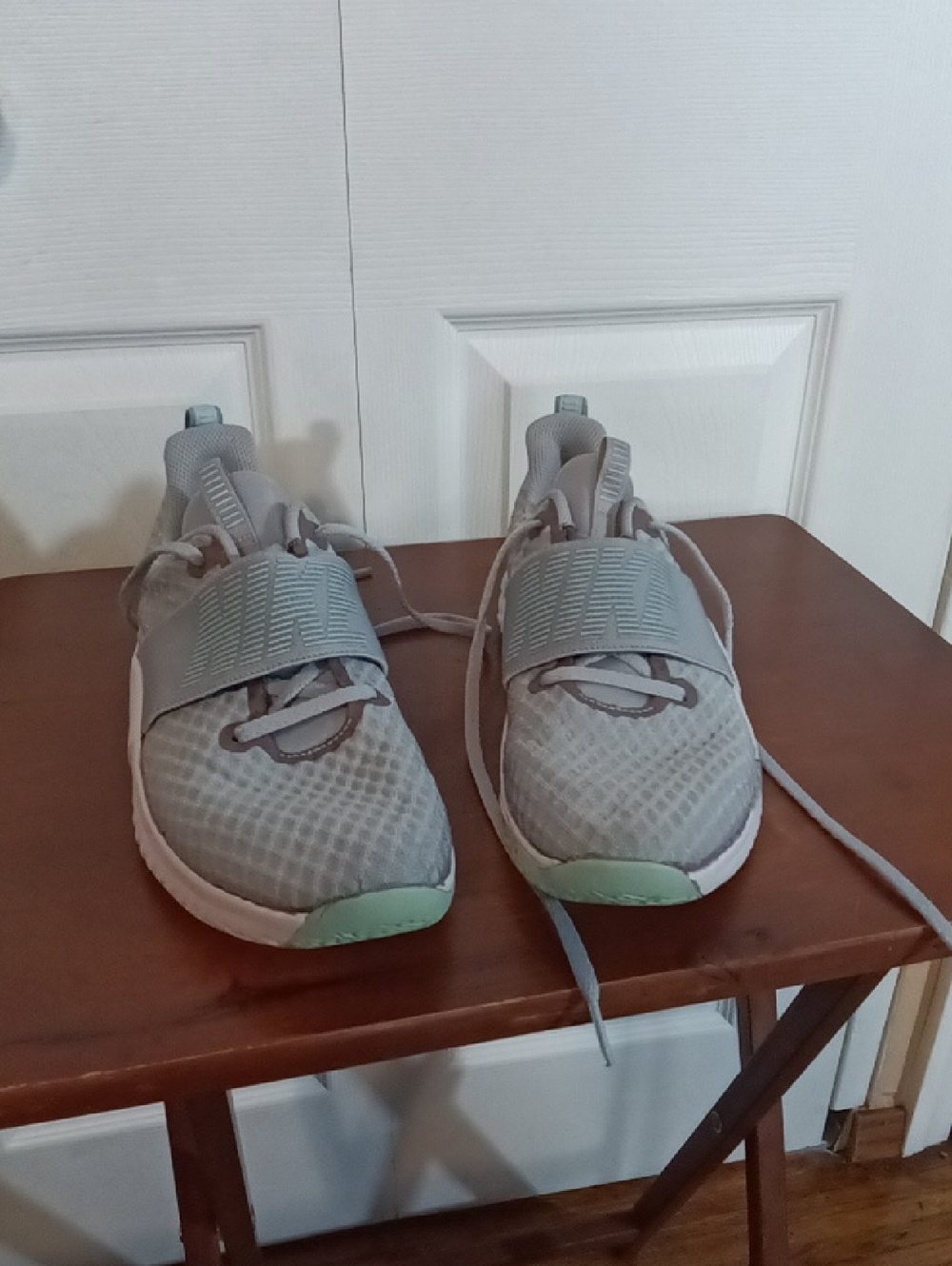 Nike Women's Light Gray Athletic Shoes with Mint Accents